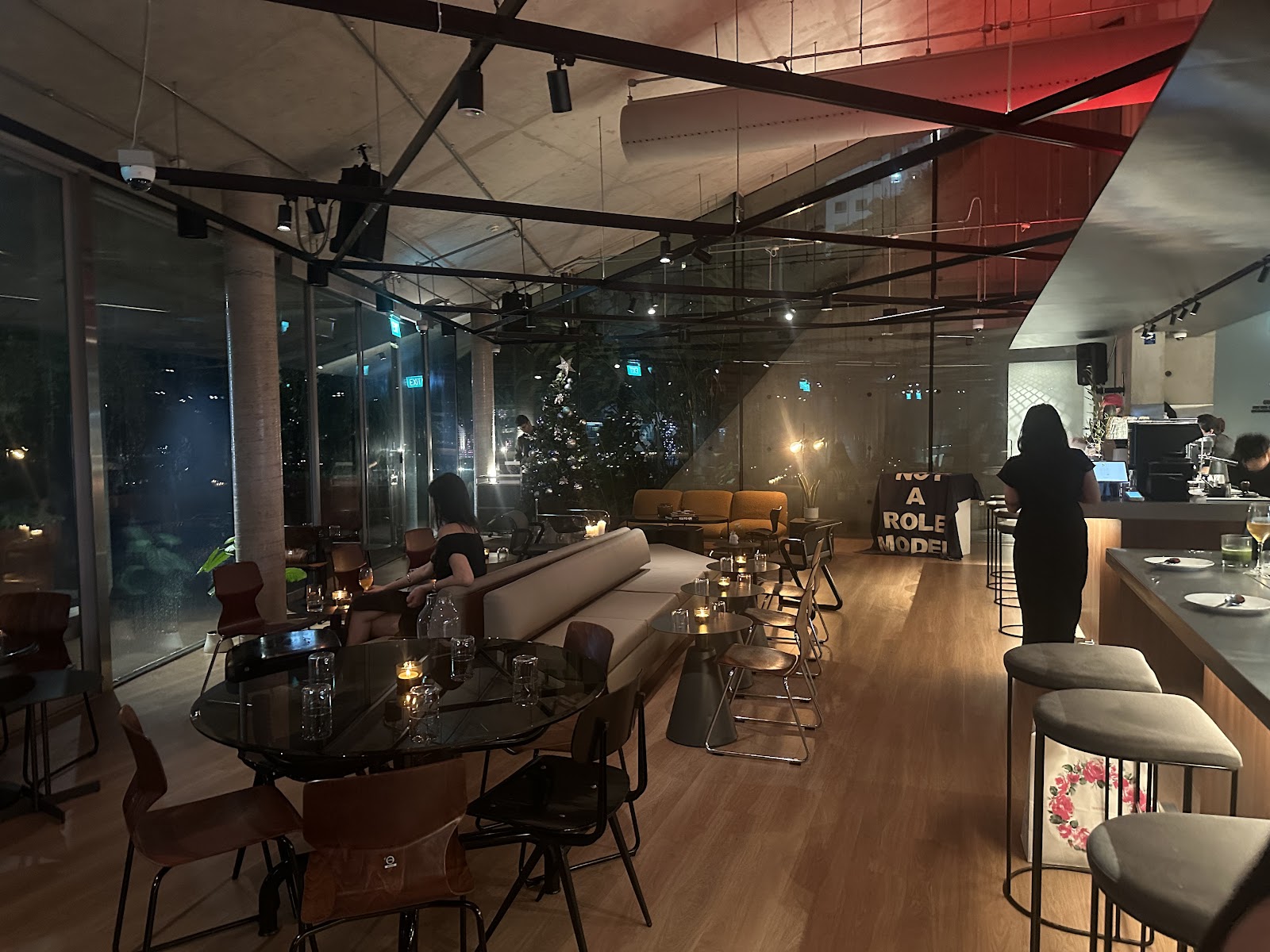 Interior of Third Floor Social with bar, lounge seating, and open kitchen